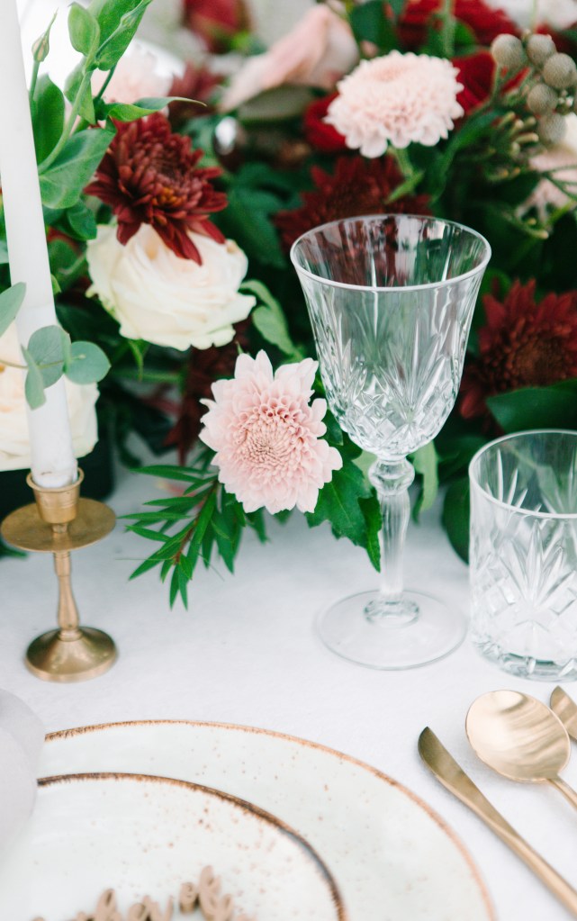 Postpone Your Wedding Different Season close up glasses candle stick flowers cuttlery plates