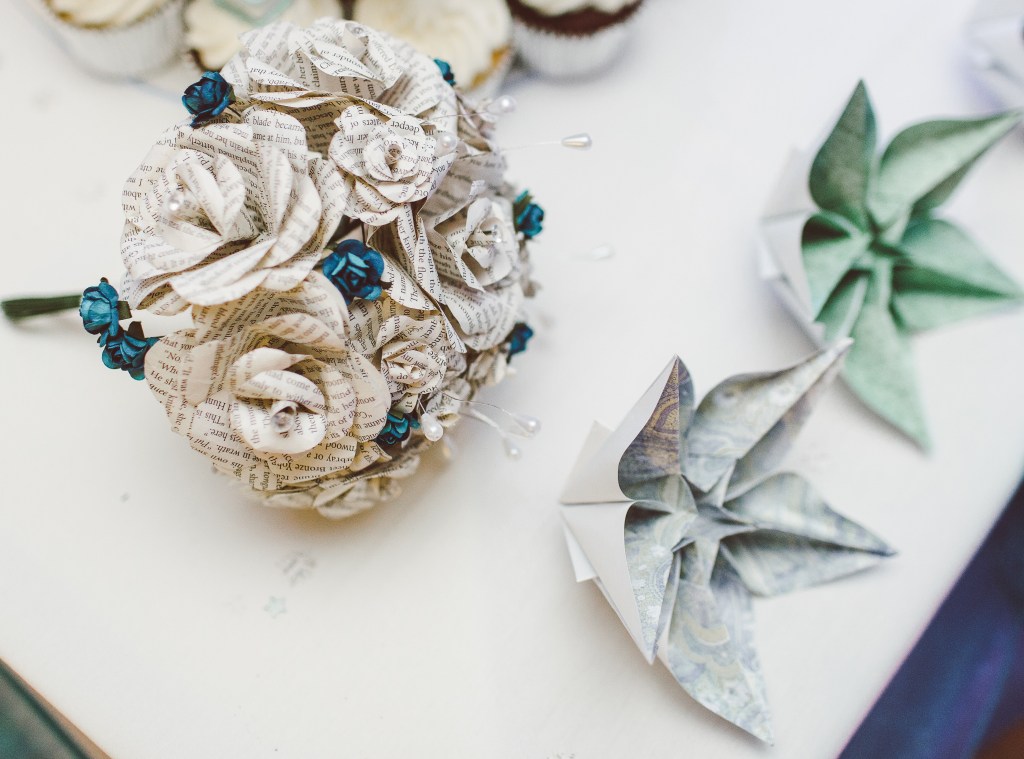 small bouquet of roses made from book pages and 2 origami stars